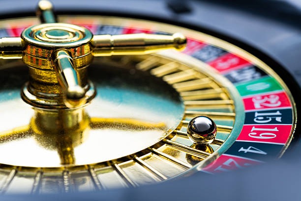Baccarat cards on table with dealer